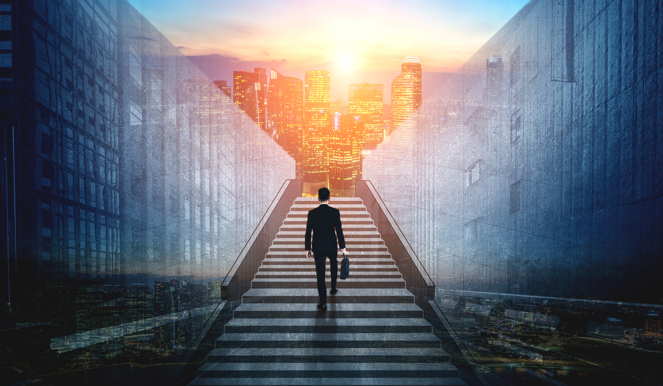 Ambitious business man climbing stairs to success.